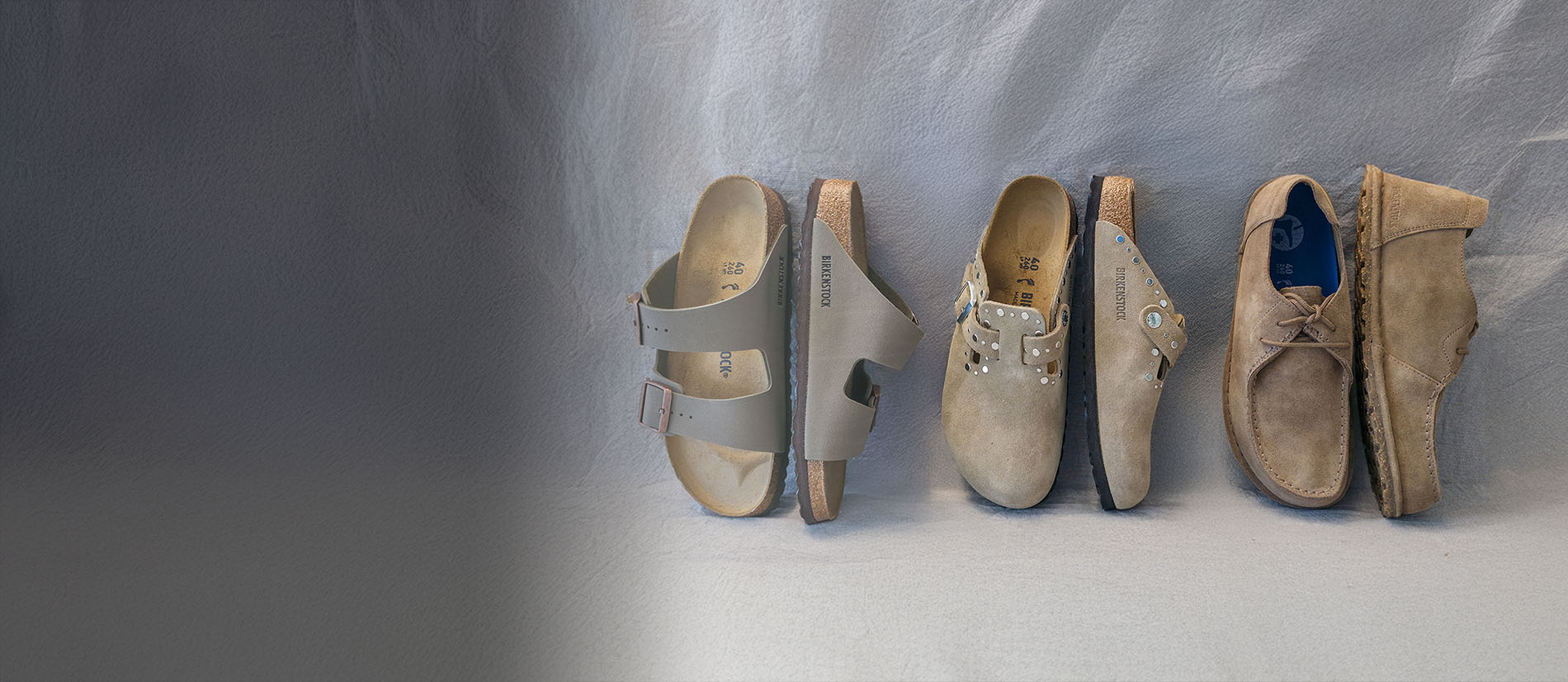 Primo piano di Birkenstock Arizona stone, boston con le borchie e scarpe utti 